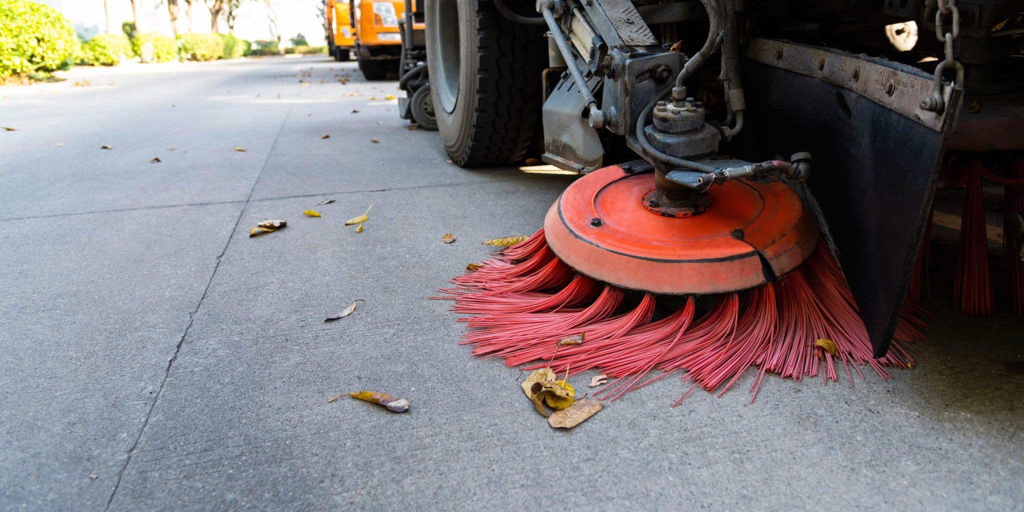 Street sweepers are cleaning city street